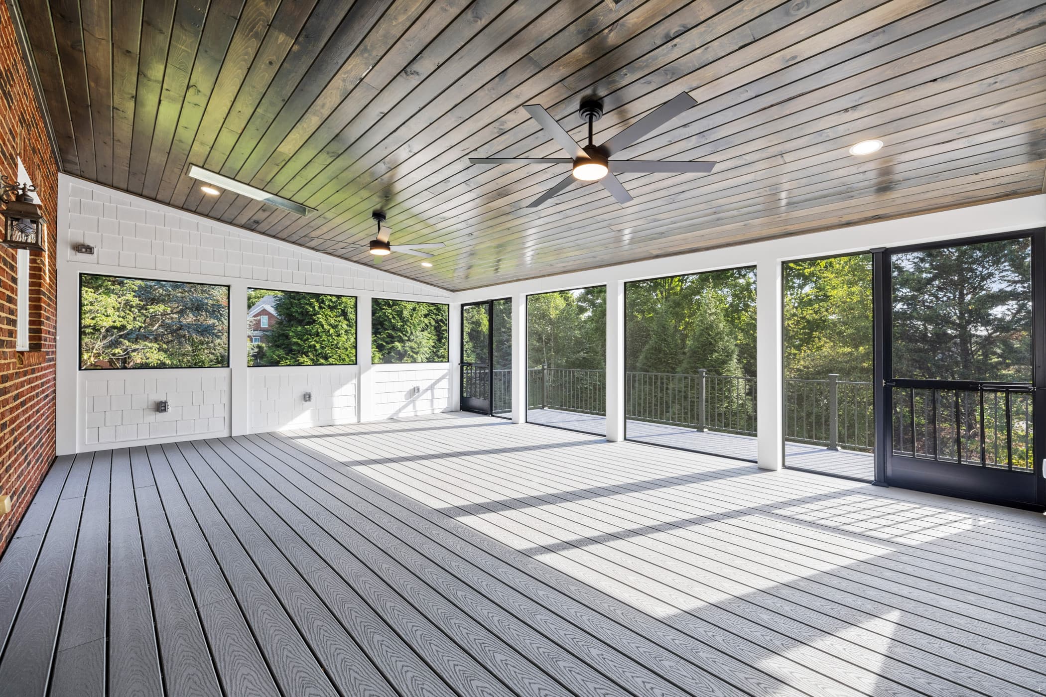 Custom multi-level deck with composite decking and black aluminum railings built by Volunteer Decks in Knoxville, TN